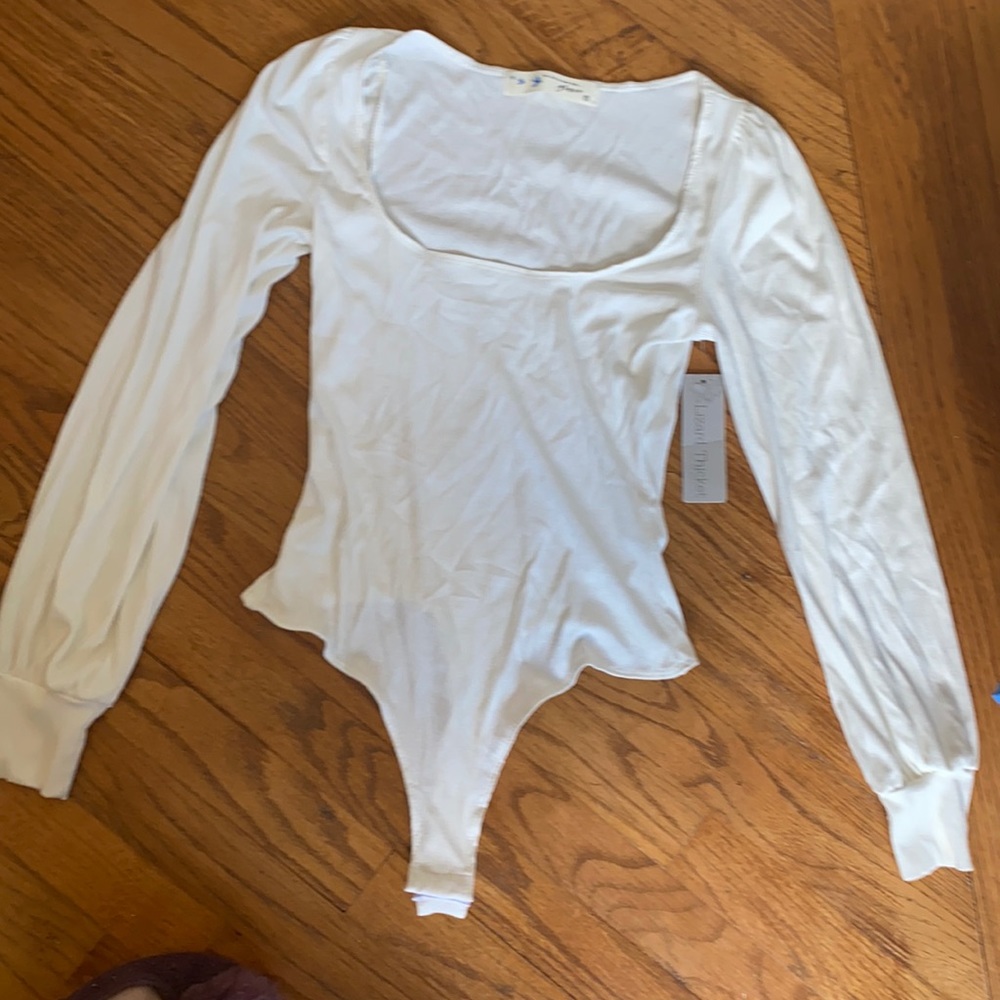 Long sleeve size small cream colored bodysuit new with tags